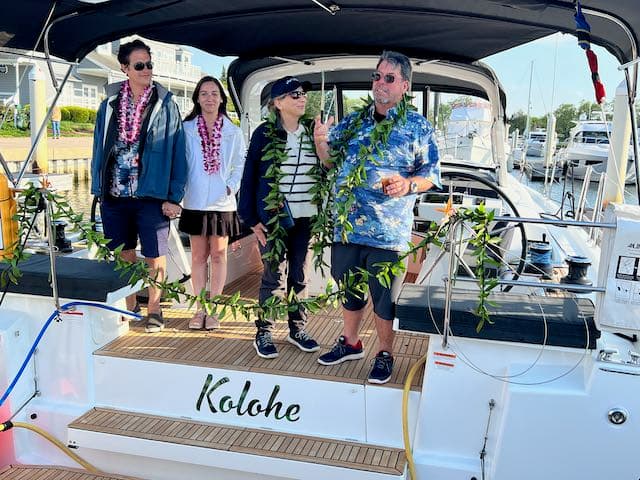 A happy new boat owner at the dock